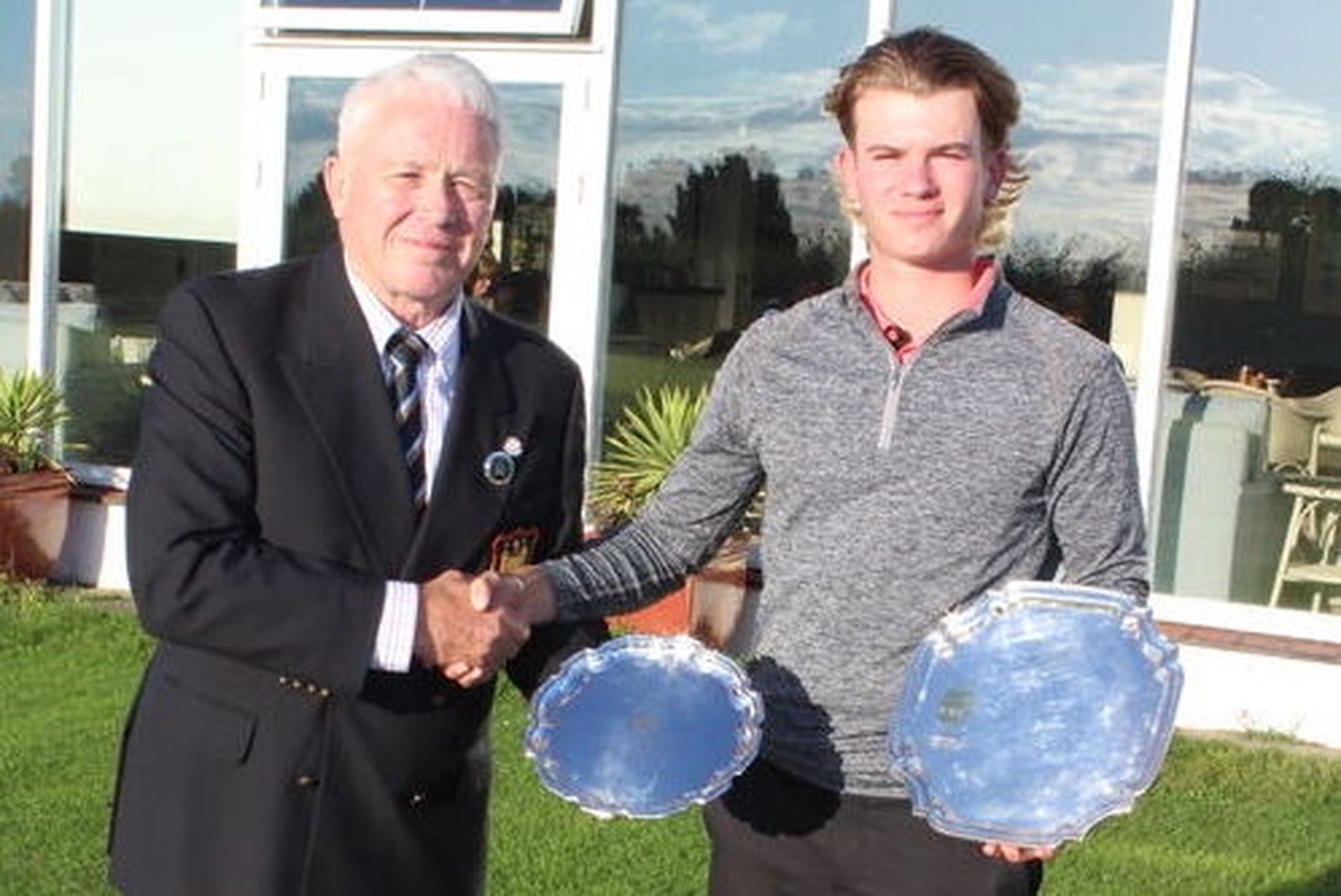 Reuben Harvey with the Order of Merit Trophy